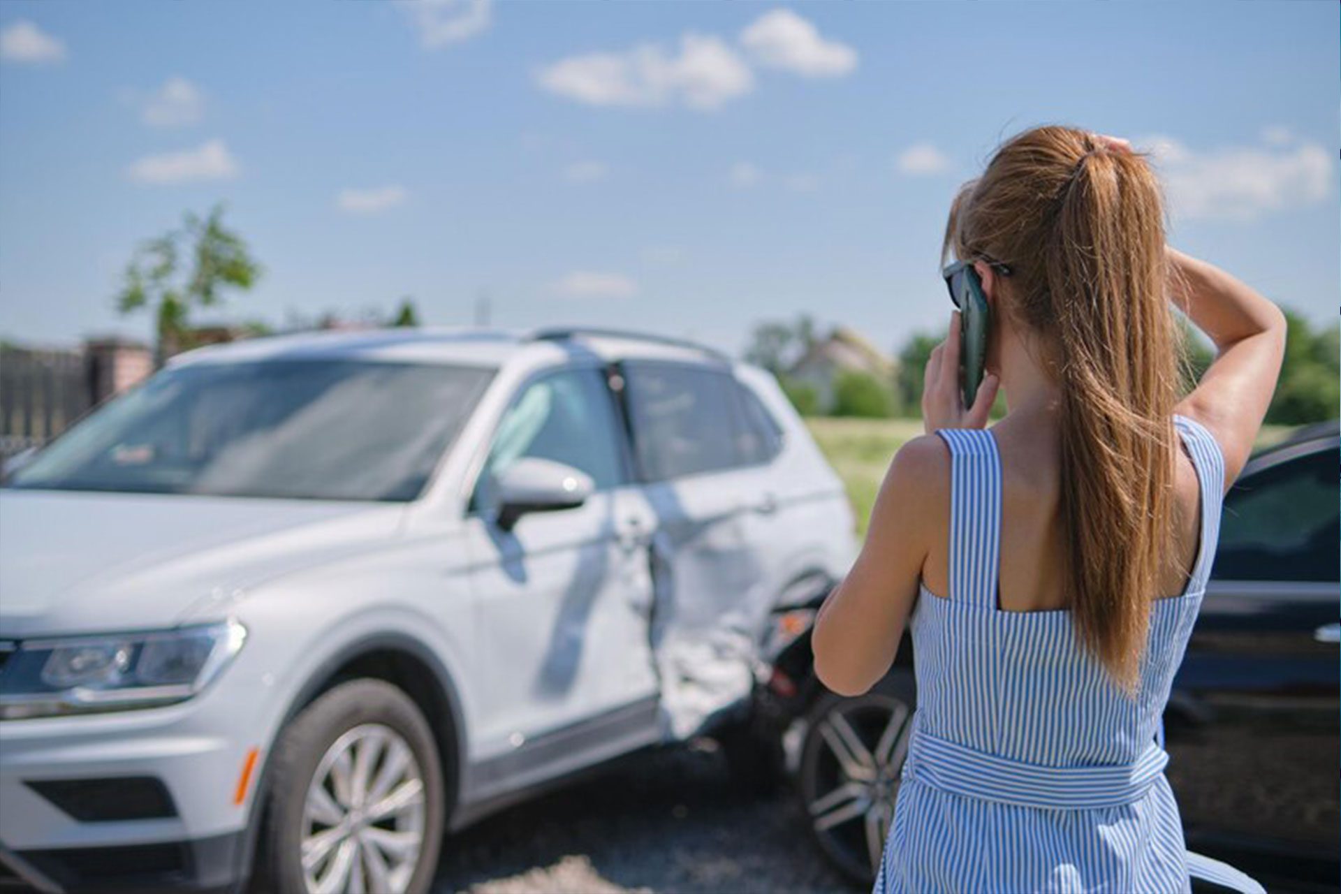 stressed-driver-talking-sellphone-roadside-near-her-smashed-vehicle-calling-emergency-service-help-after-car-accident-road-safety-insurance-concept_127089-24413